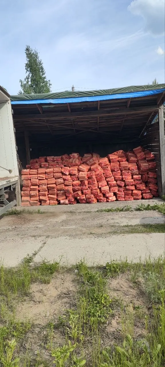 Дрова камерной сушки в сетках на складе